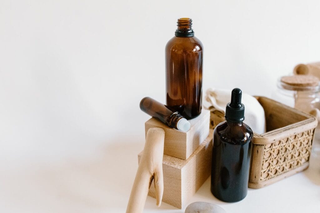 peppermint oil bottles next to other care items on white background